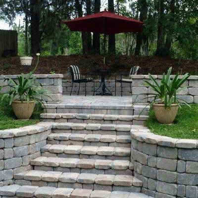 brick patio with deck structure